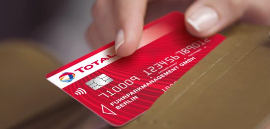 Woman's hand taking credit card out of wallet Woman's hand taking credit card out of wallet